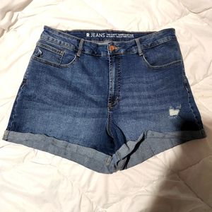Blue denim distressed jean shorts. Size 34.